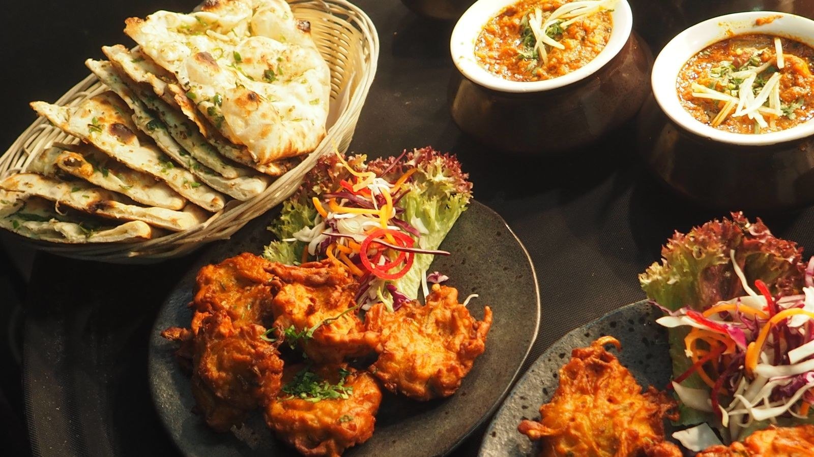 Indian wedding food spread with naan and curries
