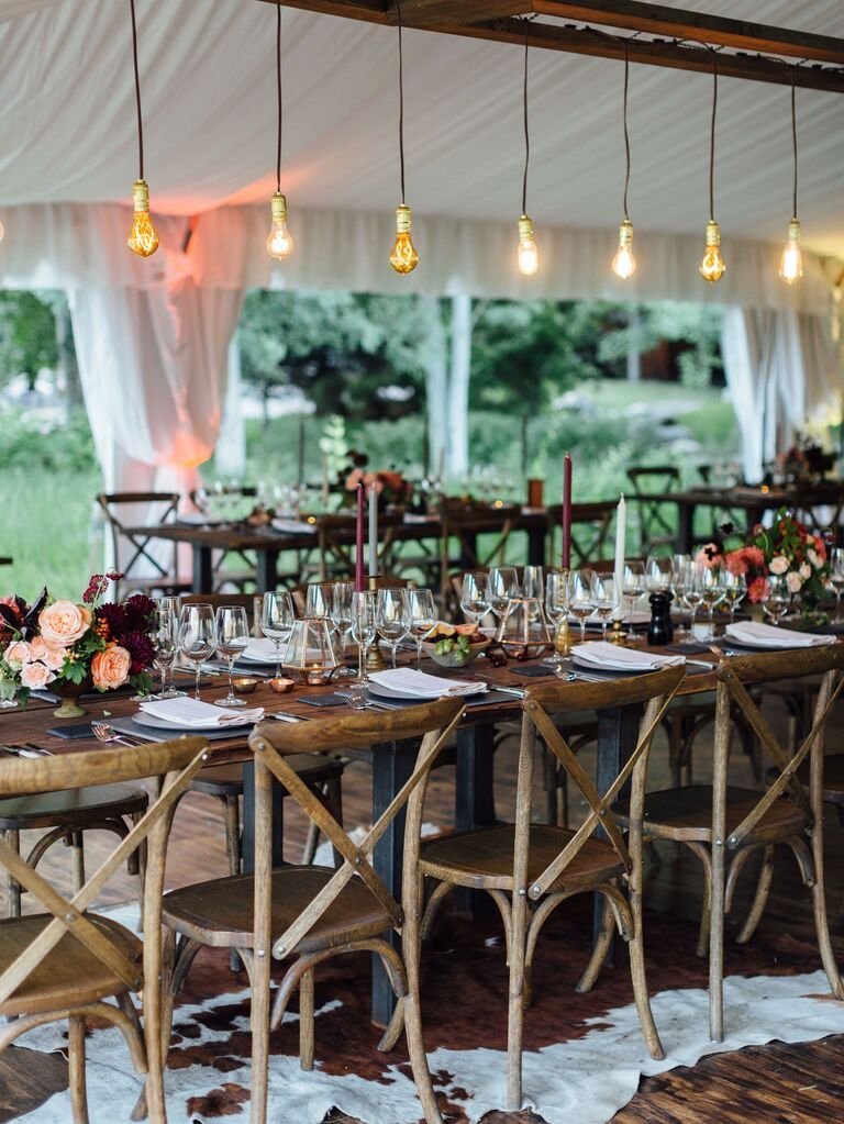 Outdoor wedding tent with Edison bulbs